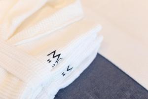 a close up of a white shirt with writing on it at Motif Hotel Çeşme in Çeşme