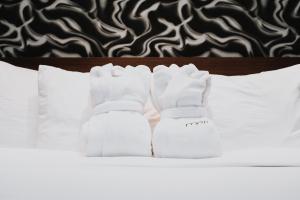 Postel nebo postele na pokoji v ubytování Mere Hotel