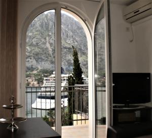 a room with a large window with a view at NEW STUDIO MUO in Kotor