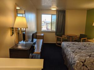 Postel nebo postele na pokoji v ubytování Horizon Hotel