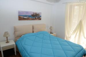 A bed or beds in a room at Dio Guesthouses Még 37 kép