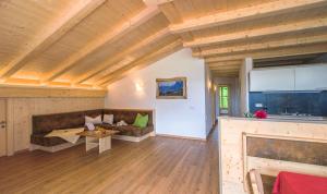 a living room with a couch and a table at Peterlungerhof in Siusi