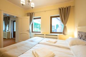 Postel nebo postele na pokoji v ubytování Apartament Hotel H
