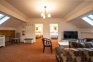 TV a/nebo společenská místnost v ubytování Apartament Hotel H