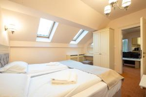 Postel nebo postele na pokoji v ubytování Apartament Hotel H