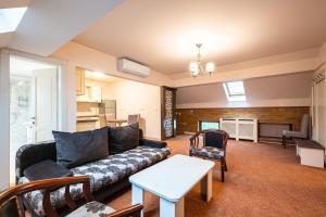 Posezení v ubytování Apartament Hotel H