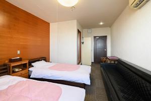 Voodi või voodid majutusasutuse Tabist HotelNakajima Fuji toas