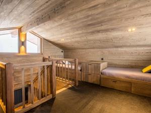 a room with two beds in a wooden cabin at Chalet La Clusaz, 6 pièces, 12 personnes - FR-1-304-211 in La Clusaz