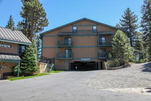 a large building with a driveway in front of it at Crestview #25 condo in Mammoth Lakes