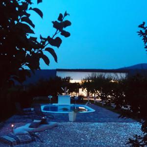 a view of a swimming pool at night at Villa Una Dalia in Bihać