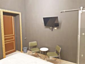 TV a/nebo společenská místnost v ubytování Room in BB - Princess Mafalda of Savoy b b