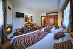 Postel nebo postele na pokoji v ubytování Hotel Victoria