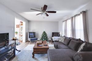 a living room with a couch and a christmas tree at Dont Get Stucked In Boston Traffic in New Bedford
