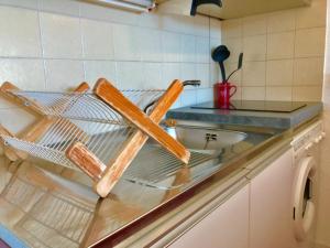 a kitchen with a sink and a counter top at Studio Villard-de-Lans, 1 pièce, 4 personnes - FR-1-515-68 in Villard-de-Lans