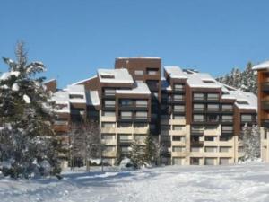 a large building with snow on top of it at Studio Corrençon-en-Vercors, 1 pièce, 4 personnes - FR-1-515-83 in Corrençon-en-Vercors