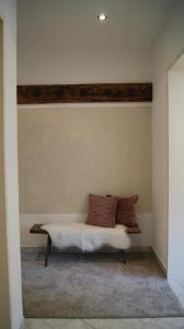 a bed in a room with a wall at Schlossbergblick in Radfeld