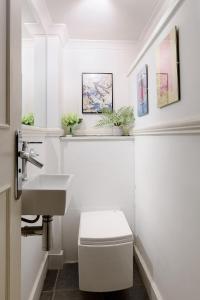 a bathroom with a sink and a toilet at Spacious 3 bedroom apt in Covent Garden in London