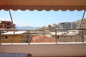 a view of a city from a balcony at Mona`s Hostel in Sarandë +14 photos
