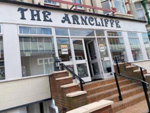 a building with a sign that reads the ant kitchen at Arncliffe Lodge Hotel in Blackpool