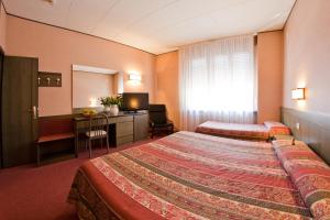 Voodi või voodid majutusasutuse Hotel Cles toas