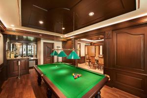 a billiard room with a green pool table at The Accord Metropolitan in Chennai