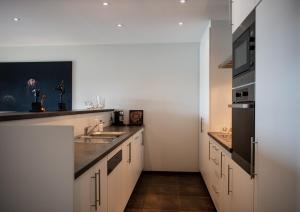 Een keuken of kitchenette bij Scheldeoever
