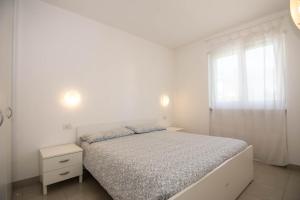 Posteľ alebo postele v izbe v ubytovaní Geranio-Buganville-Viola