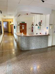 a lobby with a large counter in a building at Apartment Costa Lunar in Cabo Roig in Playas de Orihuela +69 photos