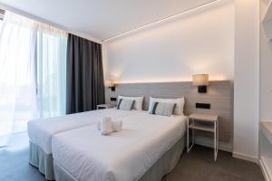 Postel nebo postele na pokoji v ubytování Art Apartments BCN + 34 fotografií
