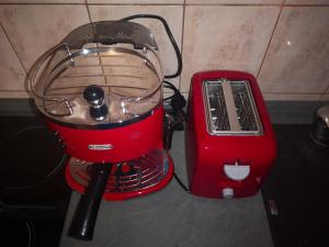 a red blender sitting next to a red toaster at Apartment Ivana in Biograd na Moru