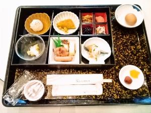 a tray filled with different types of food at Nogami President Hotel in Iizuka
