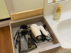 a drawer in a bathroom with a sink at Hotel Shion no Umi - Vacation STAY 98886 in Miyako Island