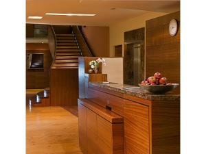 a kitchen with a bowl of fruit on a counter at SORAT Insel-Hotel Regensburg in Regensburg