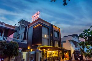 a building with a sign on top of it at Royal Livin in Varanasi