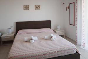 Posteľ alebo postele v izbe v ubytovaní B&B Torre Nave