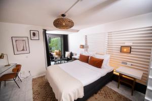 Postel nebo postele na pokoji v ubytování Nobel Hotel Ameland