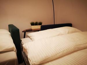 Кровать или кровати в номере Apartamenty LENA 2