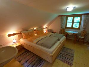 A bed or beds in a room at Alpenhaus Ganser-Dixit