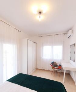A bed or beds in a room at Bella House Nikiti