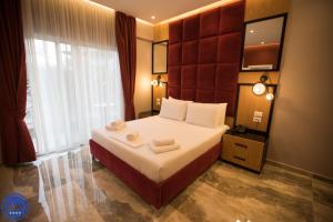 Postel nebo postele na pokoji v ubytování Blue Water Hotel Ksamil