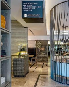 a lobby of a store with a sign on the ceiling at Hyatt Regency Cape Town in Cape Town +79 photos