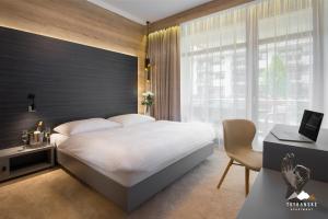 Posteľ alebo postele v izbe v ubytovaní Hrebienok Resort - Tatranské Apartmány
