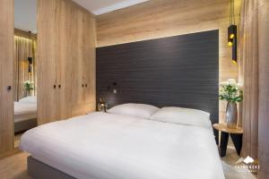 Posteľ alebo postele v izbe v ubytovaní Hrebienok Resort - Tatranské Apartmány