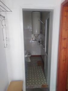 a small bathroom with a toilet and a sink at Емил in Velingrad