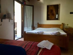 Postel nebo postele na pokoji v ubytování albergo panoramico
