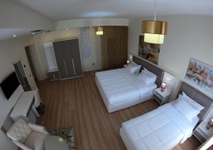 Letto o letti in una camera di Hotel TREVA