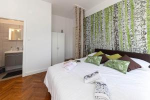 Postel nebo postele na pokoji v ubytování Apartmani Kaiserin