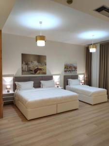 Postel nebo postele na pokoji v ubytování Hotel TREVA + 37 fotografií
