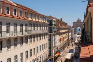 a view of a city street with buildings at Ferraria XVI FLH Hotels Lisboa in Lisbon