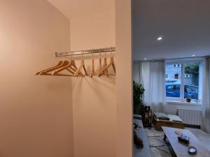 a room with a closet with wooden hangers at CABANA & Bois Dormant - Proche du Lac in Sévrier